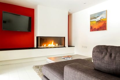 The living room with electric fire at The Shippon Cottage, Lake District