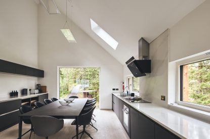 The kitchen and dining table at Munro Cabin, Loch Lomond