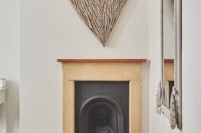 The bedroom fireplace at Ember Cottage, Cotswolds