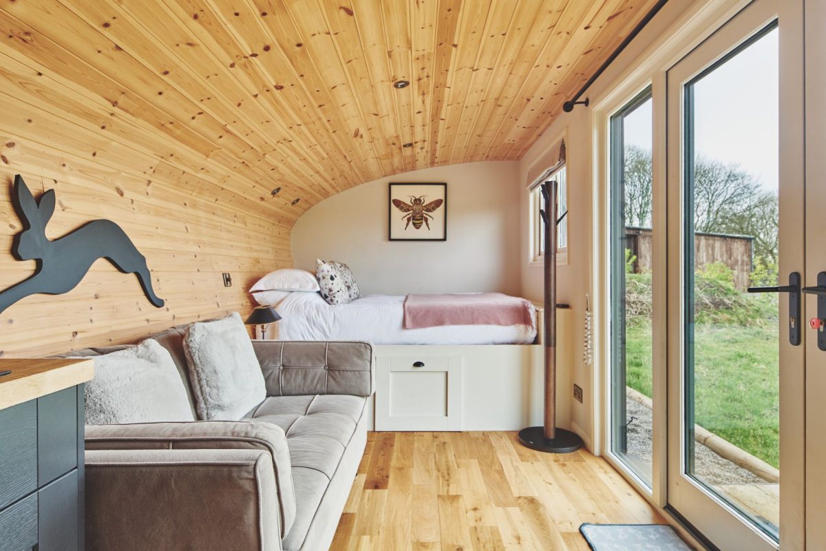 The living area and bed at Peak Cabin, Peak District