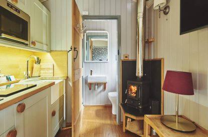 The kitchen and log burner at Falcon's Hut, Peak District