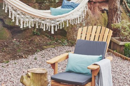 The outdoor seating area with hammock at Hidden Orchard, Cheshire