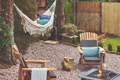 The outdoor fire pit and seating area at Hidden Orchard, Cheshire