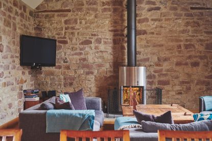 The living room with log burner at Woodpecker Loft, Peak District