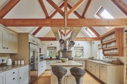 The kitchen with oak beams at Tennyson House, Cotswolds