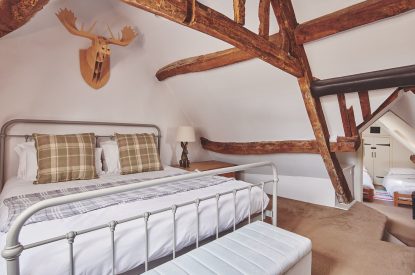 A bedroom at Crooked Cottage, Cotswolds