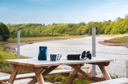 The outdoor dining area at Riverside Retreat, Devon