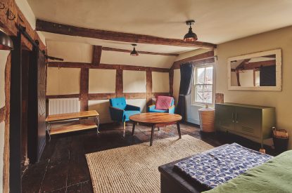 A bedroom with sitting area at Hay Market House, Powys