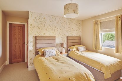 A twin bedroom at Upper Tumble Cottage, Shropshire Hills