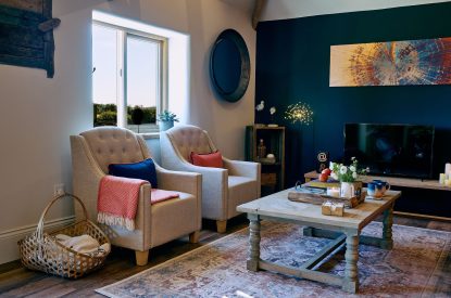 The linen armchairs and Smart TV at Stable Barn, Cotswolds