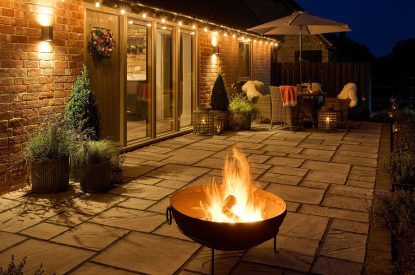 The outdoor fire pit on the patio at Stable Barn, Cotswolds
