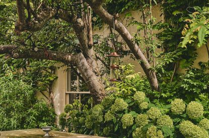 A stone picnic table in the shared garden at Sunflower Cottage, Vale of Glamorgan