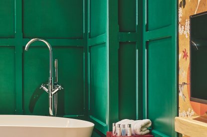 Luxury toiletries beside the bath tub at Muscari Cottage, Vale of Glamorgan