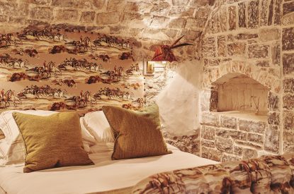 The soft furnishings on the king-size bed at Fritillaria Cottage, Vale of Glamorgan