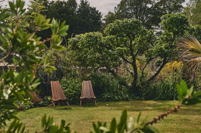 Two deck chairs in the shared garden at Fritillaria Cottage, Vale of Glamorgan