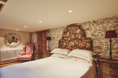 A king-size bedroom at Lotus Cottage, Vale of Glamorgan