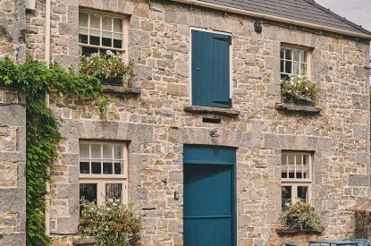 The exterior of the cottage with a table and chairs at Lotus Cottage, Vale of Glamorgan