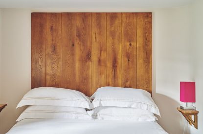 A king-size bedroom at Lotus Cottage, Vale of Glamorgan
