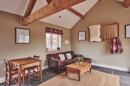 The living room and dining table and chairs at Stable Cottage, Worcestershire 