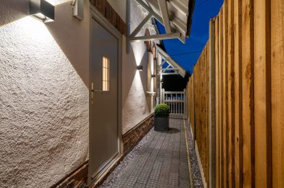 The entrance to the cottage at night at Pilgrim Cottage, Cheshire