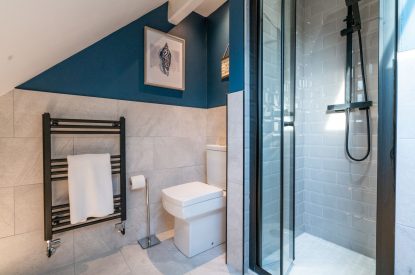 The shared bathroom with a shower at Pilgrim Cottage, Cheshire