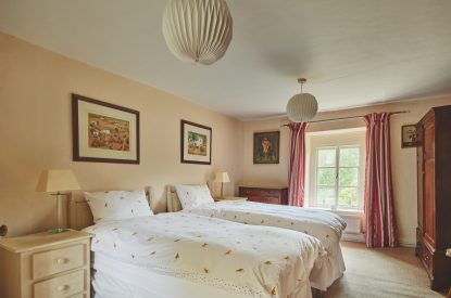 A twin bedroom at Withington Grange, Cotswolds 