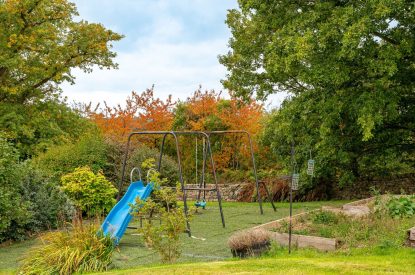 The children's play area with a slide and swing set at Tinkers Folly, Yorkshire