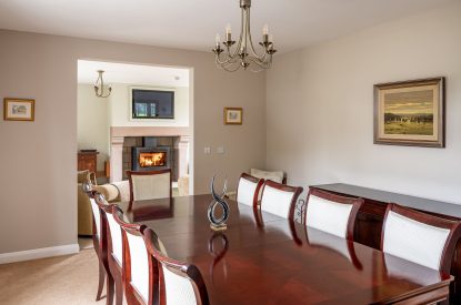 The dining room with views of the living room at Tinkers Folly, Yorkshire