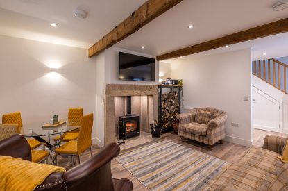 The living room with log burner at The Lee, Yorkshire