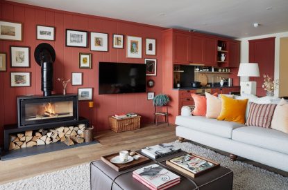 The living room with log burner at Alder Grand Suite, Cotswolds