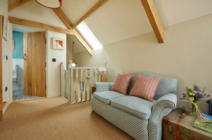 The sitting area in the bedroom at Haymaker Barn, Cotswolds