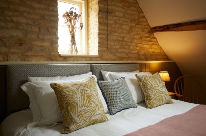 A double bed at Orchard Stable, Cotswolds