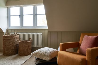 A sitting area in the bedroom at Lakeside Manor, Cotswolds