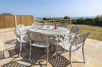 The outdoor dining area at Beesands Vista, Devon