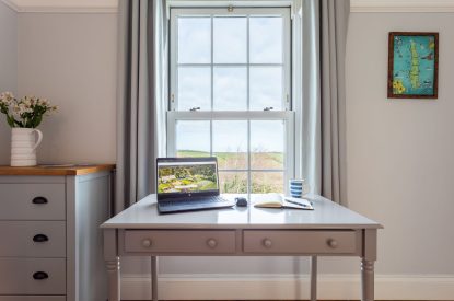 A desk with countryside view at Millook View Farmhouse, Cornwall
