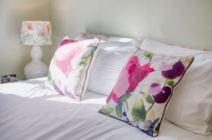 A double bed at Woodbury Cottage, Devon