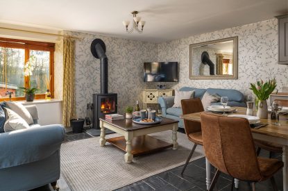 The living room with log burner at Cuckoo Cottage, Devon