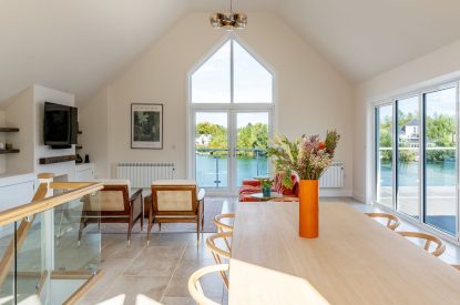 The open plan living and dining space at Lakefront Lodge, Cotswolds