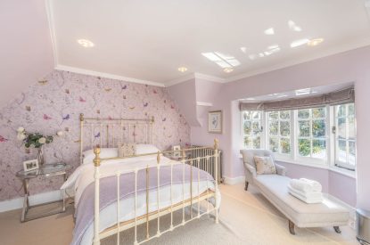 A bedroom with four poster bed at Rose Cottage, Isle of Wight