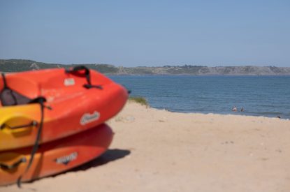 Canoes on the beach next to Teacher's Cottage, Gower