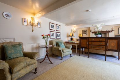 Two armchairs in the living room at Thatch Corner, Somerset