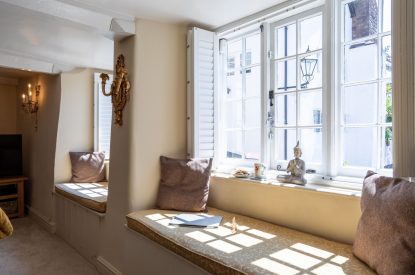 Bay window seats which overlooking the village streets at Thatch Corner, Somerset