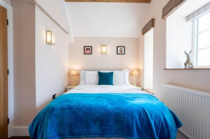 A double bedroom with vaulted ceiling at Exmoor Barn, Somerset