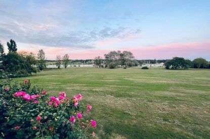 The view across the garden towards the sea at Brickworks and Vines, Isle of Wight