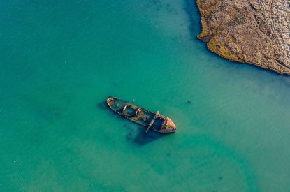 A boat wreck in the sea at Brickworks and Vines, Isle of Wight