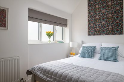 A double bedroom with vaulted ceiling at Farmyard Cottage, Wiltshire