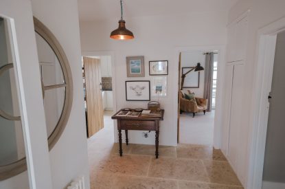 The hallway leading to the living room and bedrooms at Brickworks and Vines, Isle of Wight