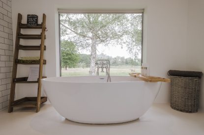 A large family bathroom with free standing bath at Brickworks and Vines, Isle of Wight