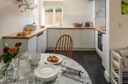 The dining table in the kitchen at The Milking Parlour, Wiltshire 