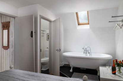 The roll top bath in the bedroom at The Milking Parlour, Wiltshire 